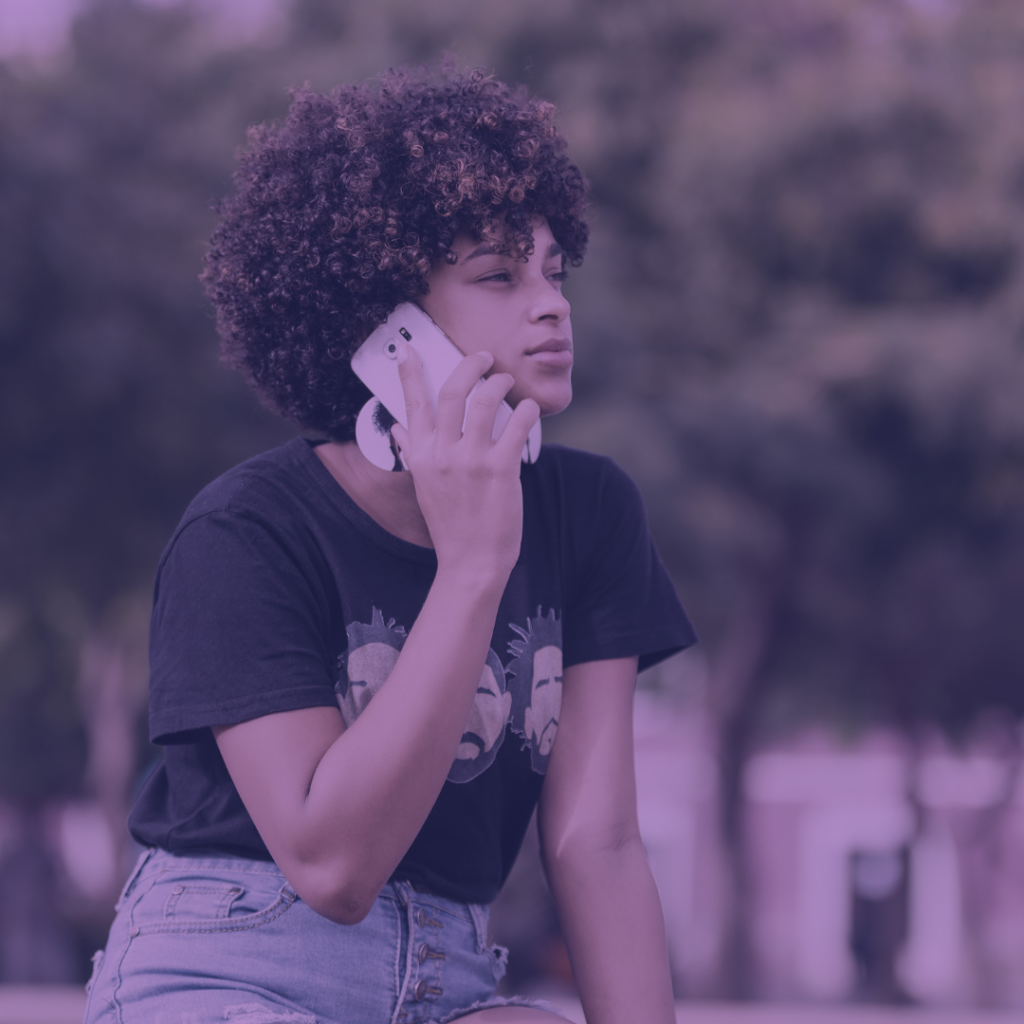 a woman outside on a cellphone