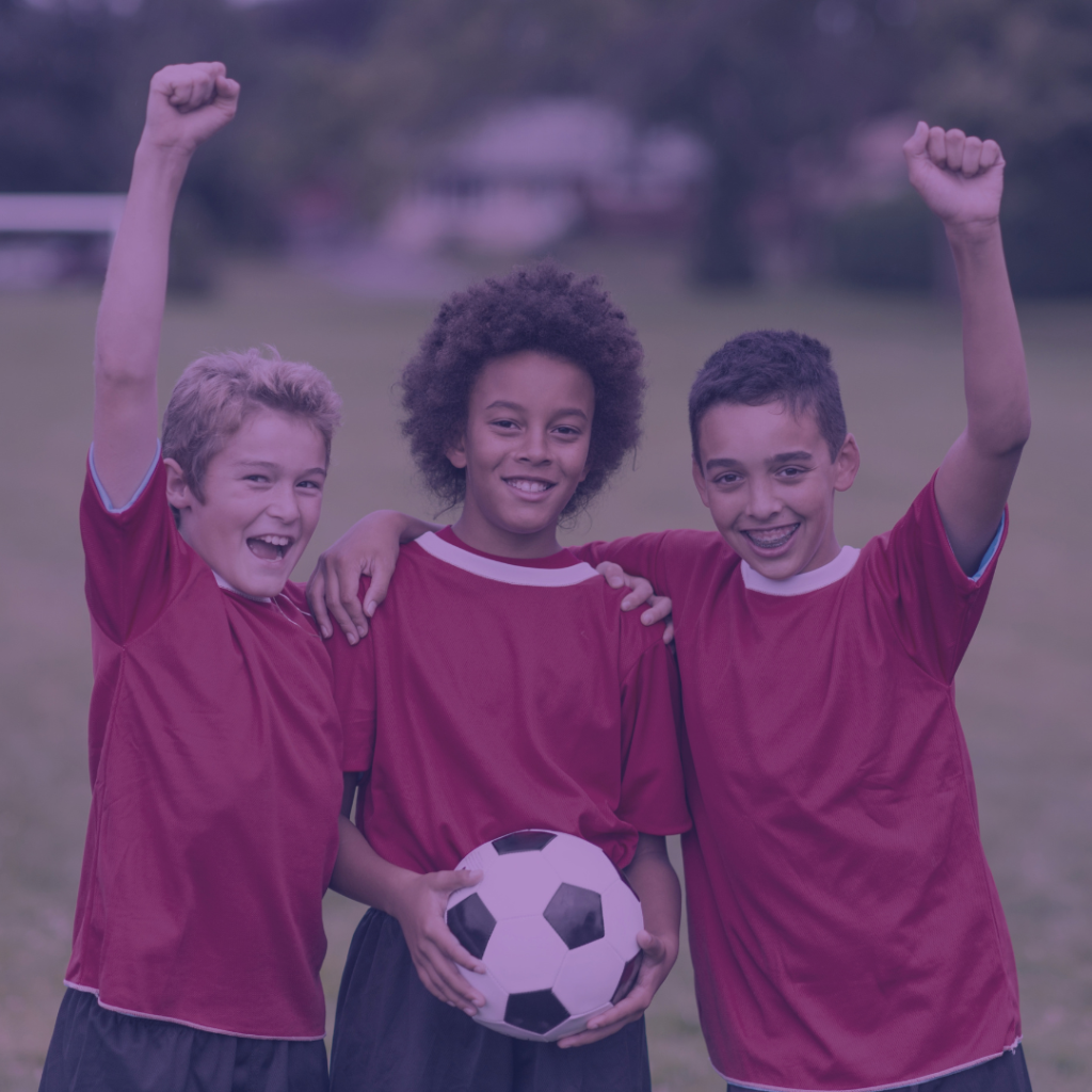 three boys on a soccer team